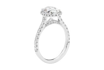Antique style halo ring available in platinum or white gold.