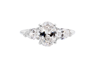 Oval trilogy ring featuring oval brilliant cut and pear cut diamond. Available in White Gold, Yellow Gold, Rose Gold or Platinum
