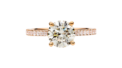 Stunning round brilliant cut diamond set on rose gold band.
