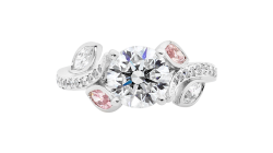 Round and marguise brilliant cut diamond ring available in white gold or platinum.