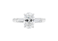 Oval Trilogy ring with oval brilliant cut and tapered baguette. Available in White Gold, Yellow Gold, Rose Gold or Platinum