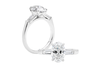 Oval Trilogy ring with oval brilliant cut and tapered baguette. Available in White Gold, Yellow Gold, Rose Gold or Platinum