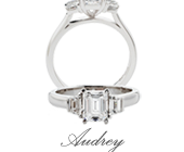Emerald Cut Diamond Engagement Ring featuring Two Trapezoid Diamonds In The Shoulder