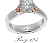 Round Brilliant Cut Diamond Solitaire Ring featuring Two Pear Shaped Argyle Pinks