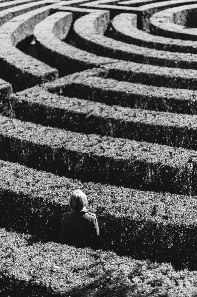 A person lost inside of a maze
